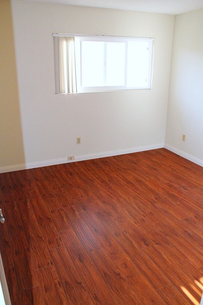 Large secon bedroom with hardwood floor