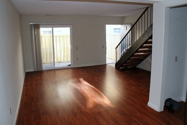 Huge Living Room with New Hardwood Laminate Floor and Built-in Bookcase