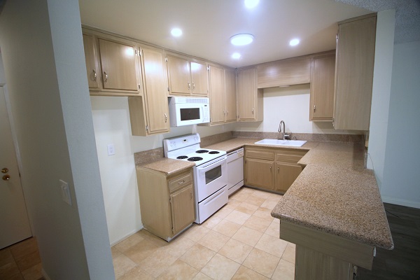 Modern Kitchen with built in appliances and custom cabinetry
